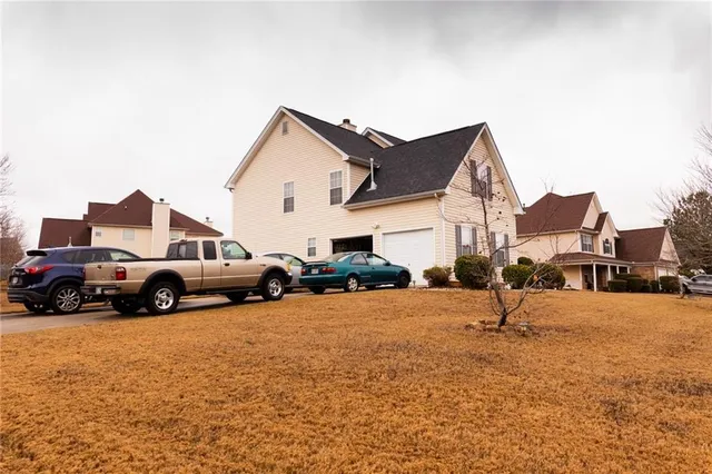 a view of a car parked in front of house