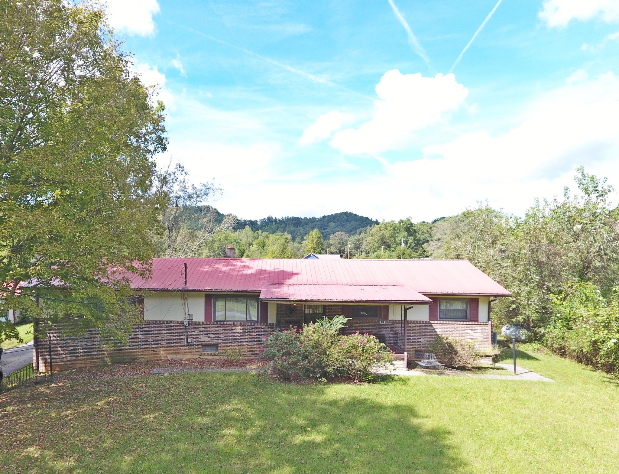 864 East Wolf Valley Road Heiskell, TN 37754 - Photo 1 of 17 a view of a house with a yard