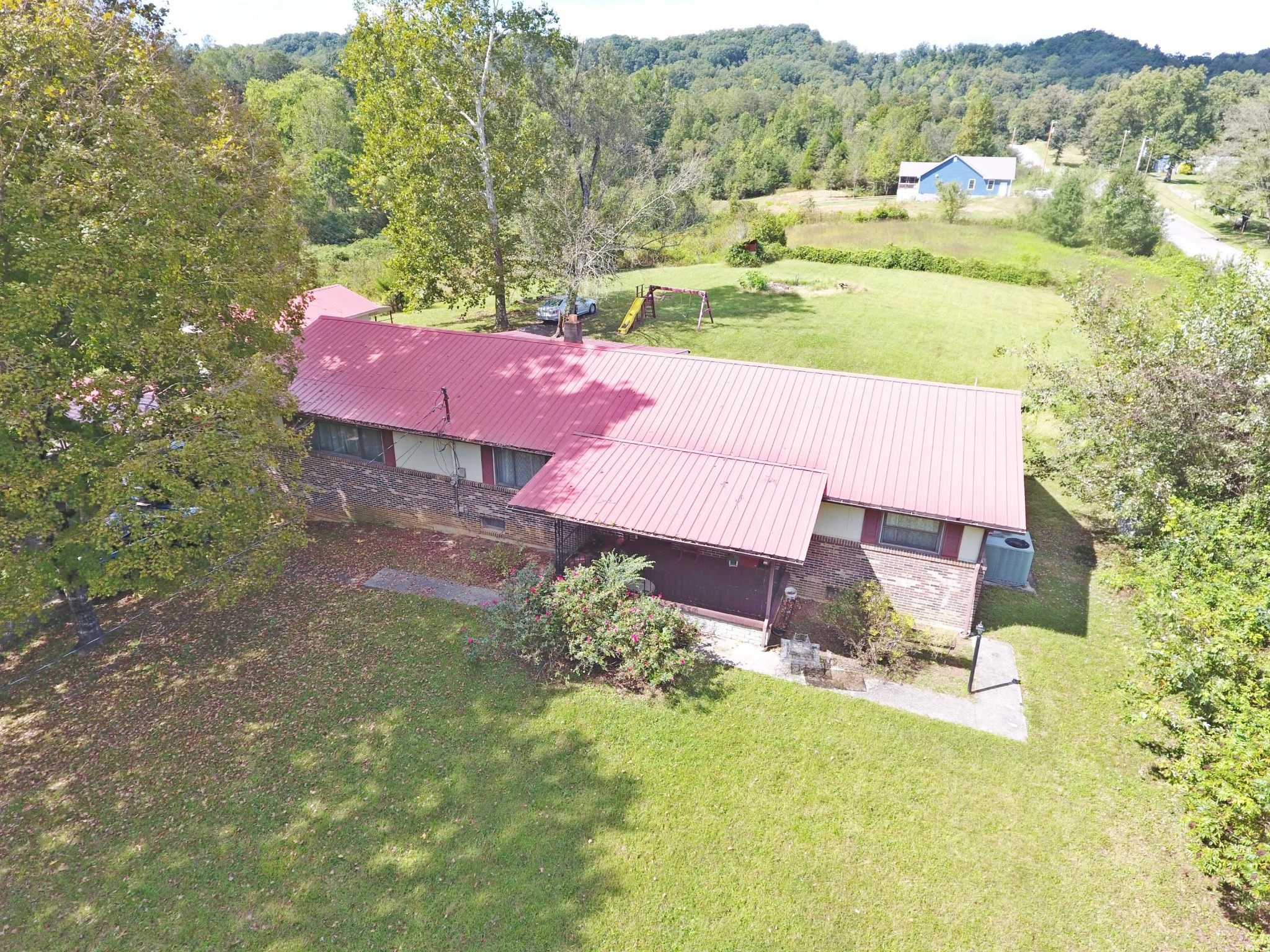 864 East Wolf Valley Road Heiskell, TN 37754 - Photo 13 of 17 a view of a house with a yard and sitting area