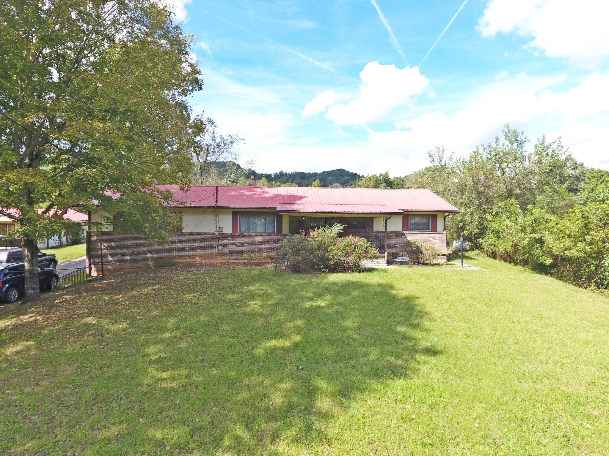 864 East Wolf Valley Road Heiskell, TN 37754 - Photo 14 of 17 a front view of a house with a yard