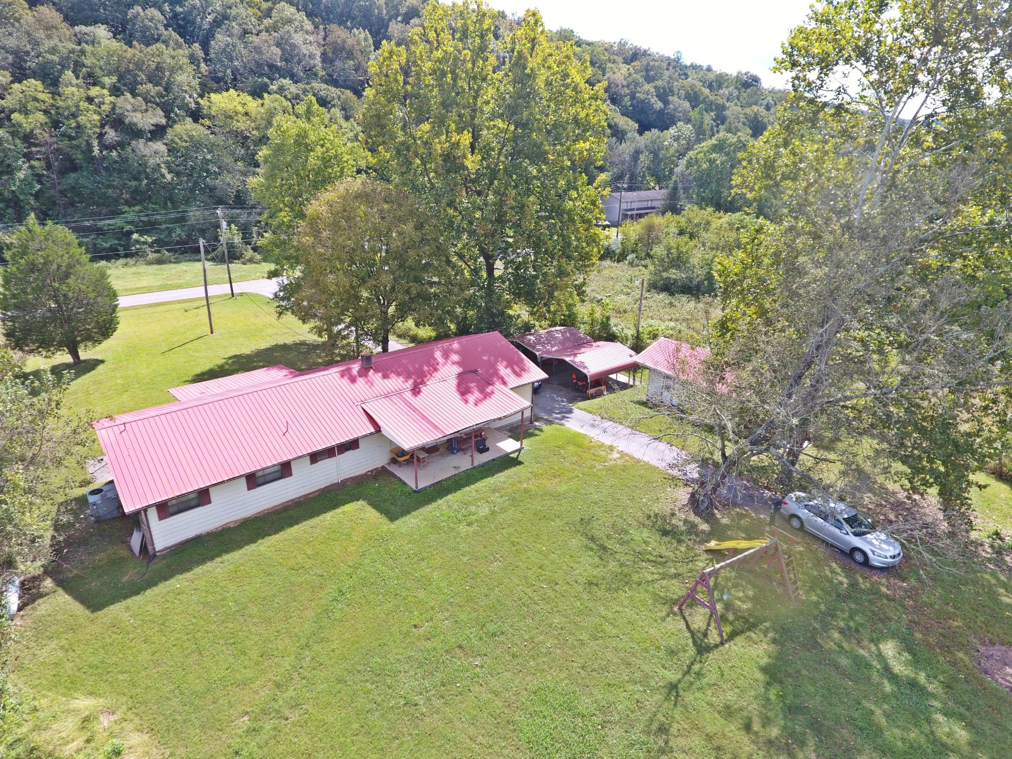 864 East Wolf Valley Road Heiskell, TN 37754 - Photo 5 of 17 an aerial view of a house with a garden and swimming pool