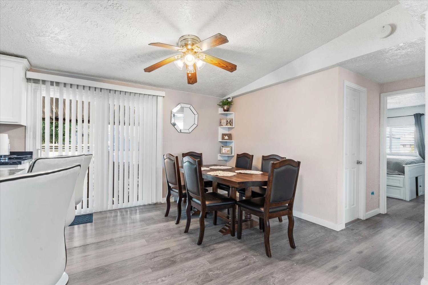 159 Village Circle Sacramento, CA 95838 - Photo 11 of 38 a view of a dining room with furniture and chandelier