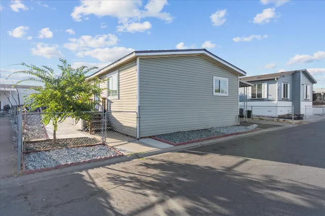 a backyard of a house with yard and garage