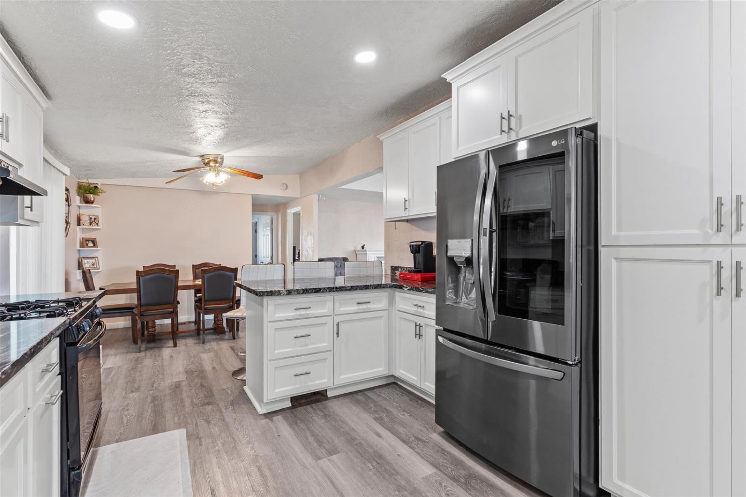 159 Village Circle Sacramento, CA 95838 - Photo 21 of 38 a kitchen with stainless steel appliances a refrigerator stove microwave and cabinets