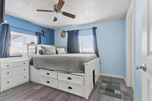 a bedroom with a bed and a dresser