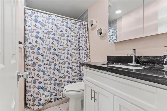 a view of a bathroom with a sink a toilet and a shower