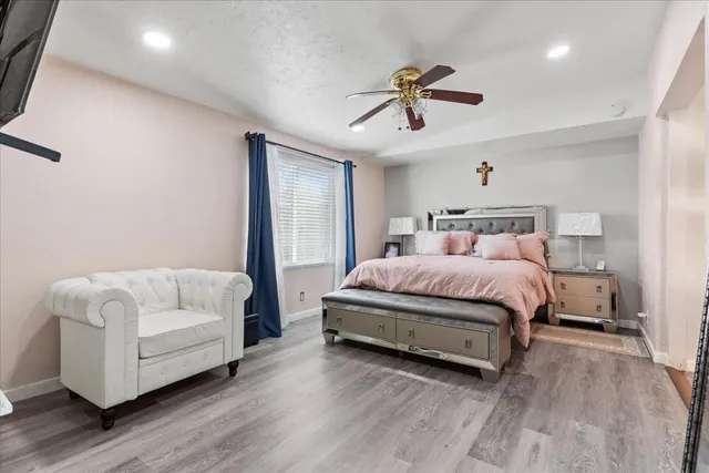 a bedroom with bed and white walls