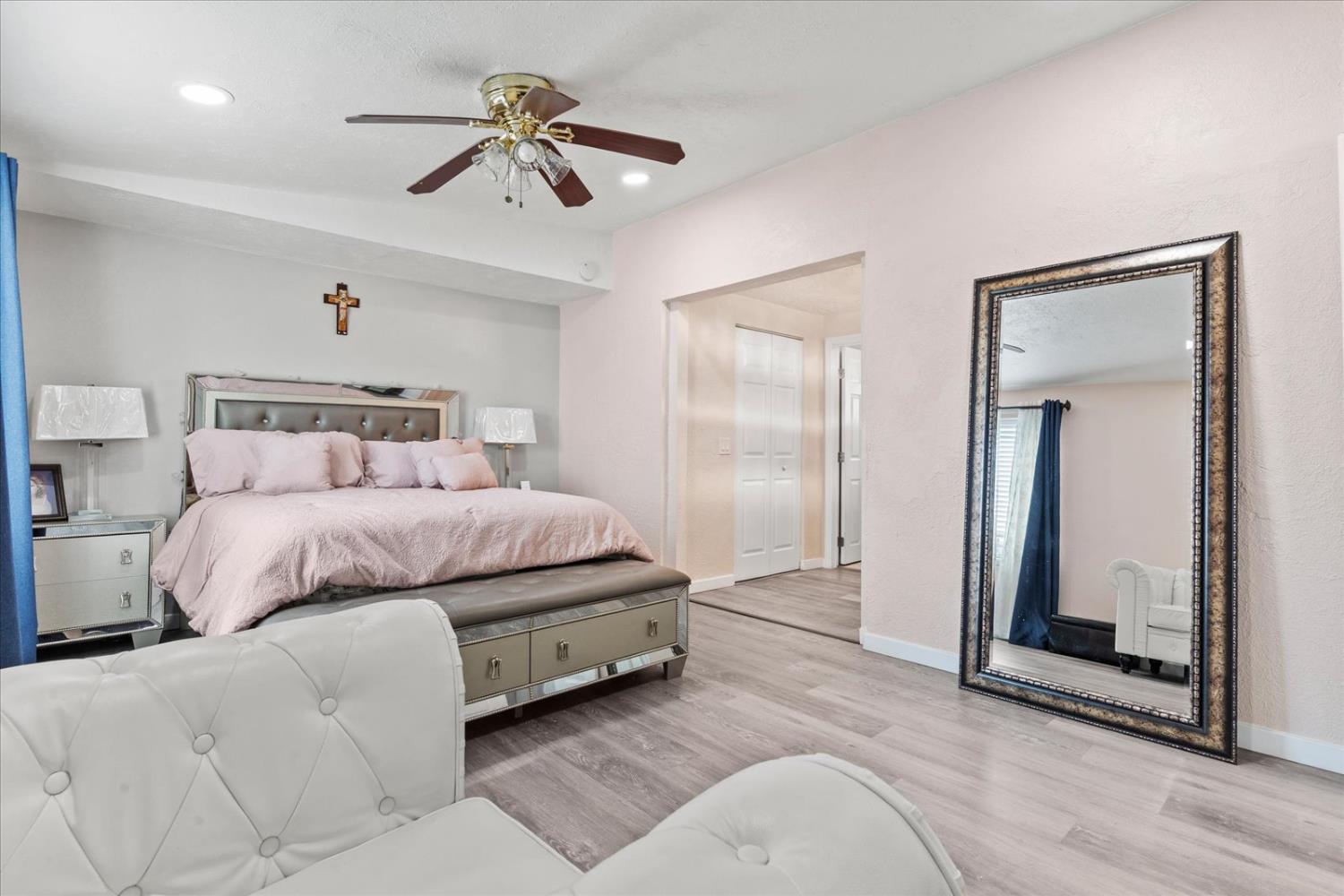 159 Village Circle Sacramento, CA 95838 - Photo 32 of 38 a bedroom with a bed and a chandelier