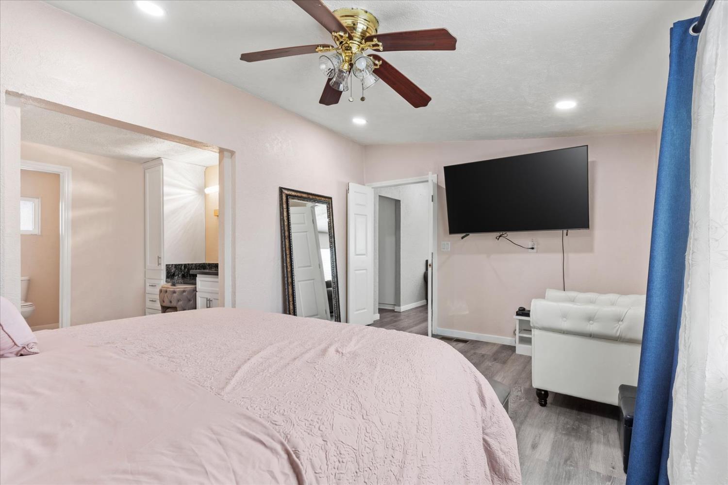 159 Village Circle Sacramento, CA 95838 - Photo 33 of 38 a bedroom with a bed and a flat screen tv