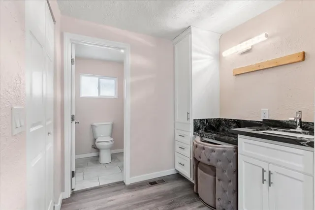a kitchen with a stove and a sink