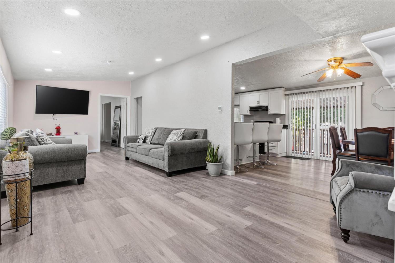 159 Village Circle Sacramento, CA 95838 - Photo 5 of 38 a living room with furniture and a flat screen tv