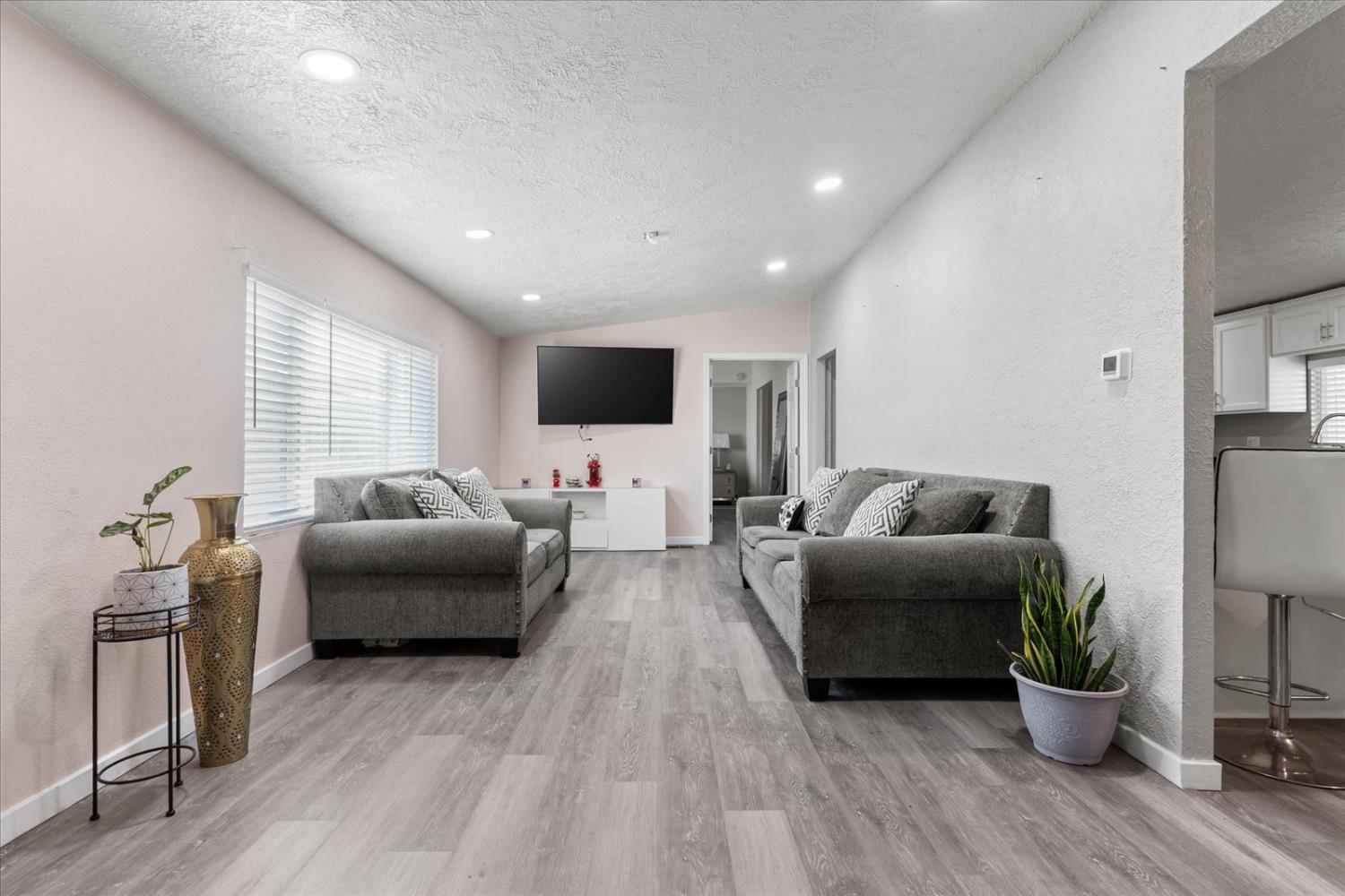 159 Village Circle Sacramento, CA 95838 - Photo 6 of 38 a living room with furniture and a flat screen tv