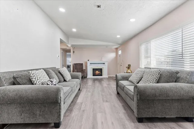 a living room with furniture and a fireplace