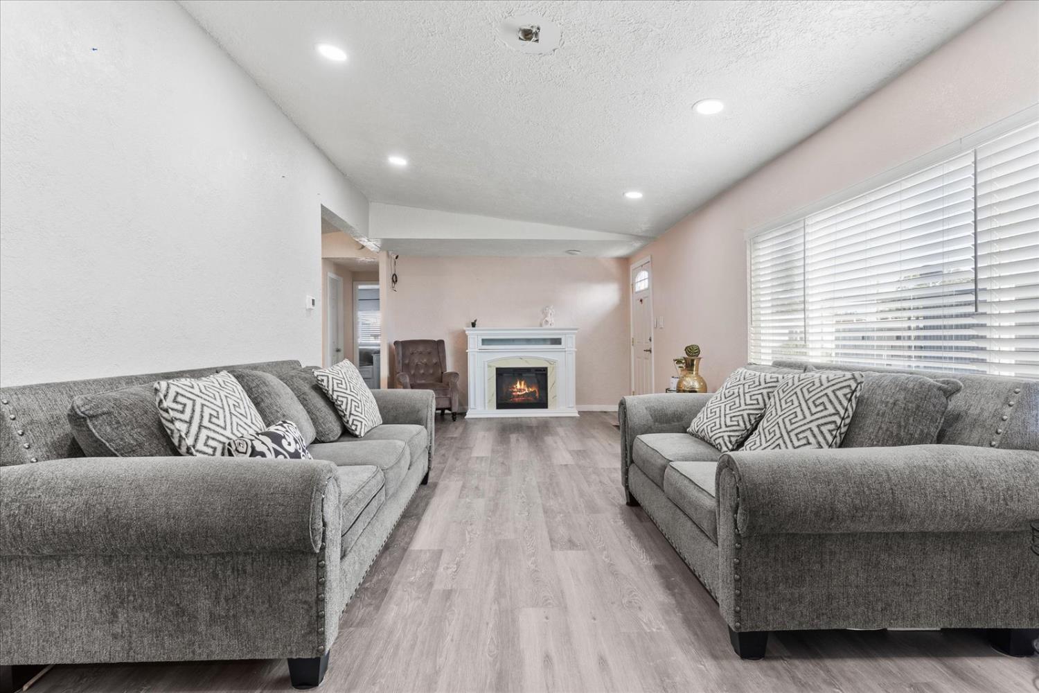 159 Village Circle Sacramento, CA 95838 - Photo 9 of 38 a living room with furniture and a fireplace
