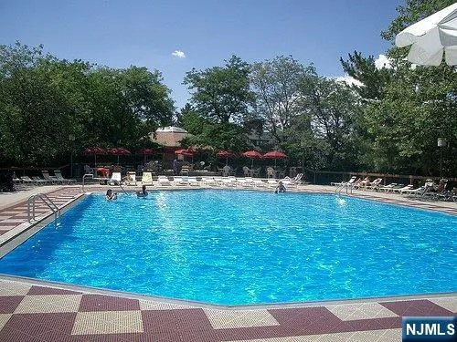a swimming pool with wooden fence