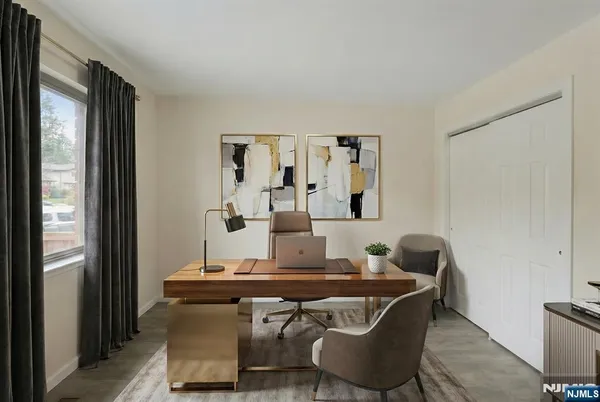 a dining room with furniture and wooden floor