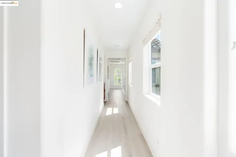 a view of a hallway with white walls