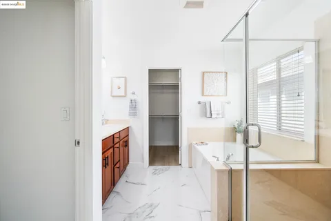a bathroom with a tub and shower
