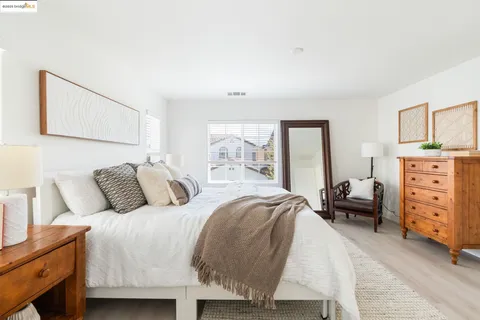 a view of a chairs and table in the backyard