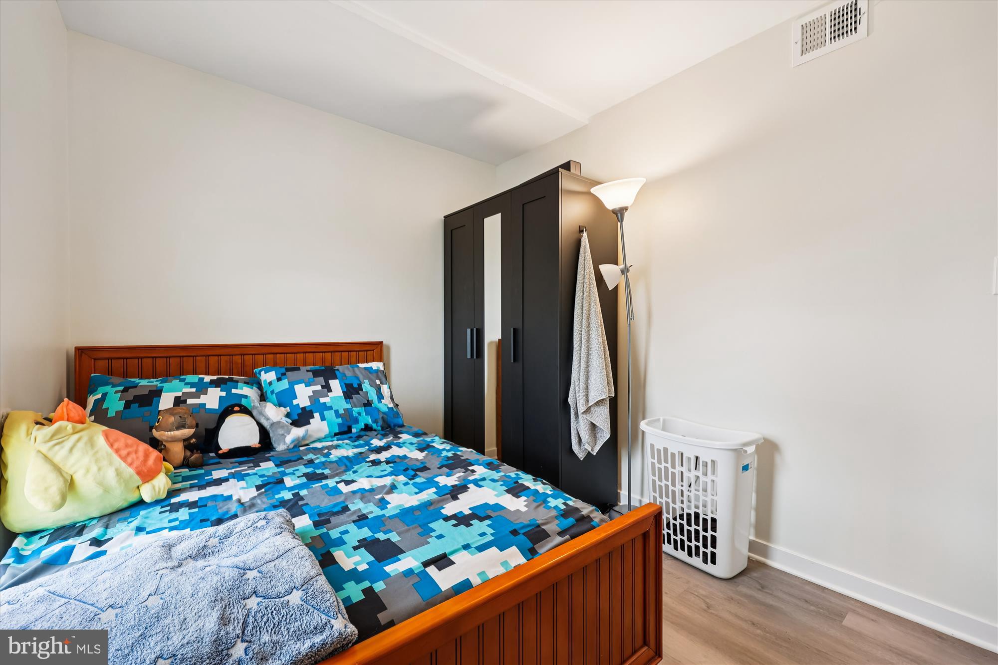 8313 Shady Spring Drive Gaithersburg, MD 20877 - Photo 13 of 30 a bed sitting in a bedroom next to a window