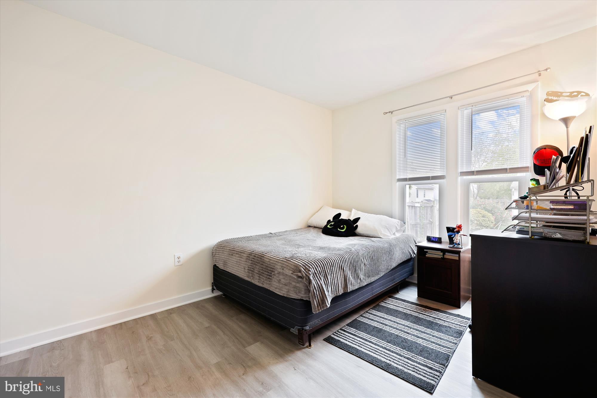 8313 Shady Spring Drive Gaithersburg, MD 20877 - Photo 16 of 30 a bedroom with a bed and window