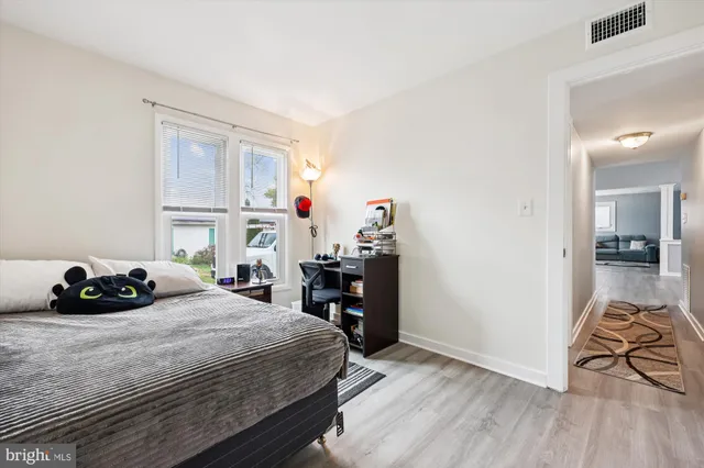 a bedroom with a bed and a table