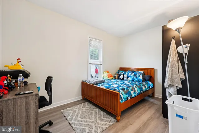 a bed room with furniture and a window