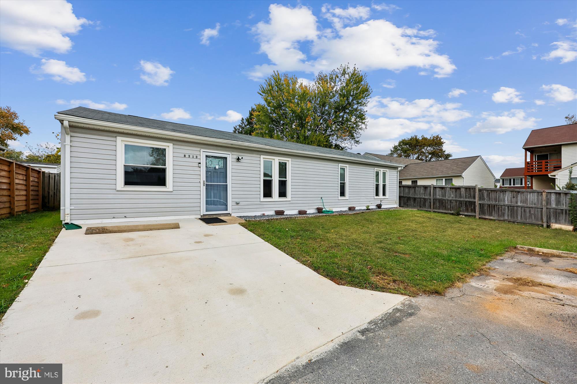 8313 Shady Spring Drive Gaithersburg, MD 20877 - Photo 24 of 30 a front view of house with yard and green space