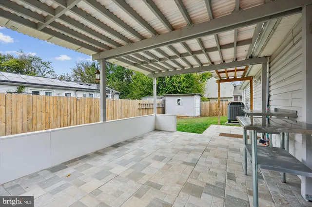 a view of a porch with wooden fence