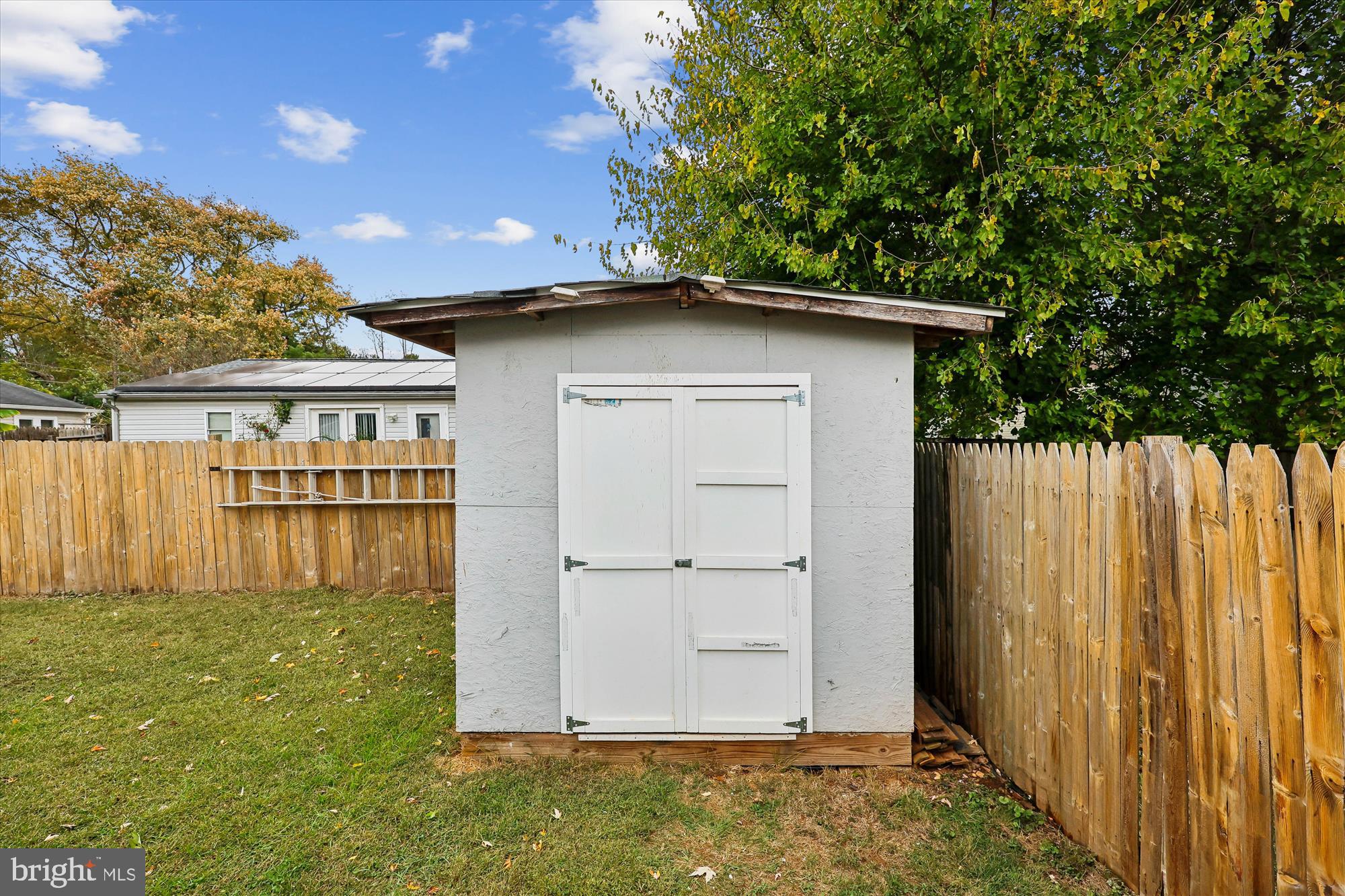 8313 Shady Spring Drive Gaithersburg, MD 20877 - Photo 30 of 30 a front view of a house with a yard