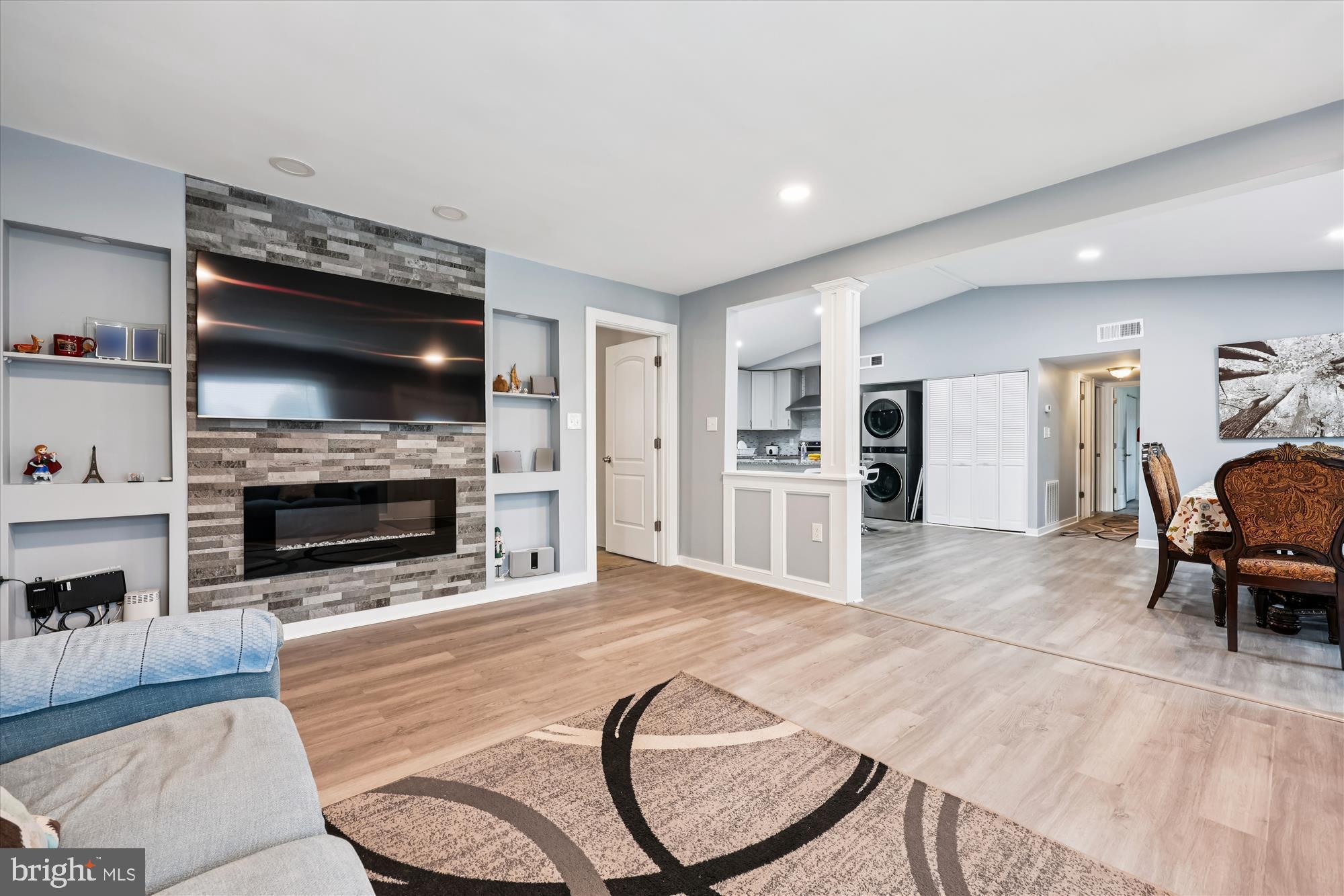 8313 Shady Spring Drive Gaithersburg, MD 20877 - Photo 8 of 30 a living room with furniture and a fireplace