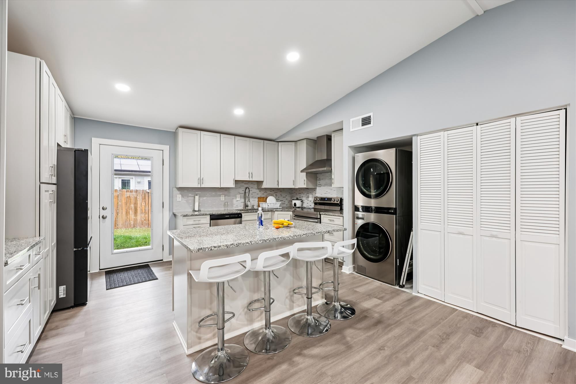 8313 Shady Spring Drive Gaithersburg, MD 20877 - Photo 9 of 30 a kitchen with stainless steel appliances granite countertop a refrigerator and a stove top oven