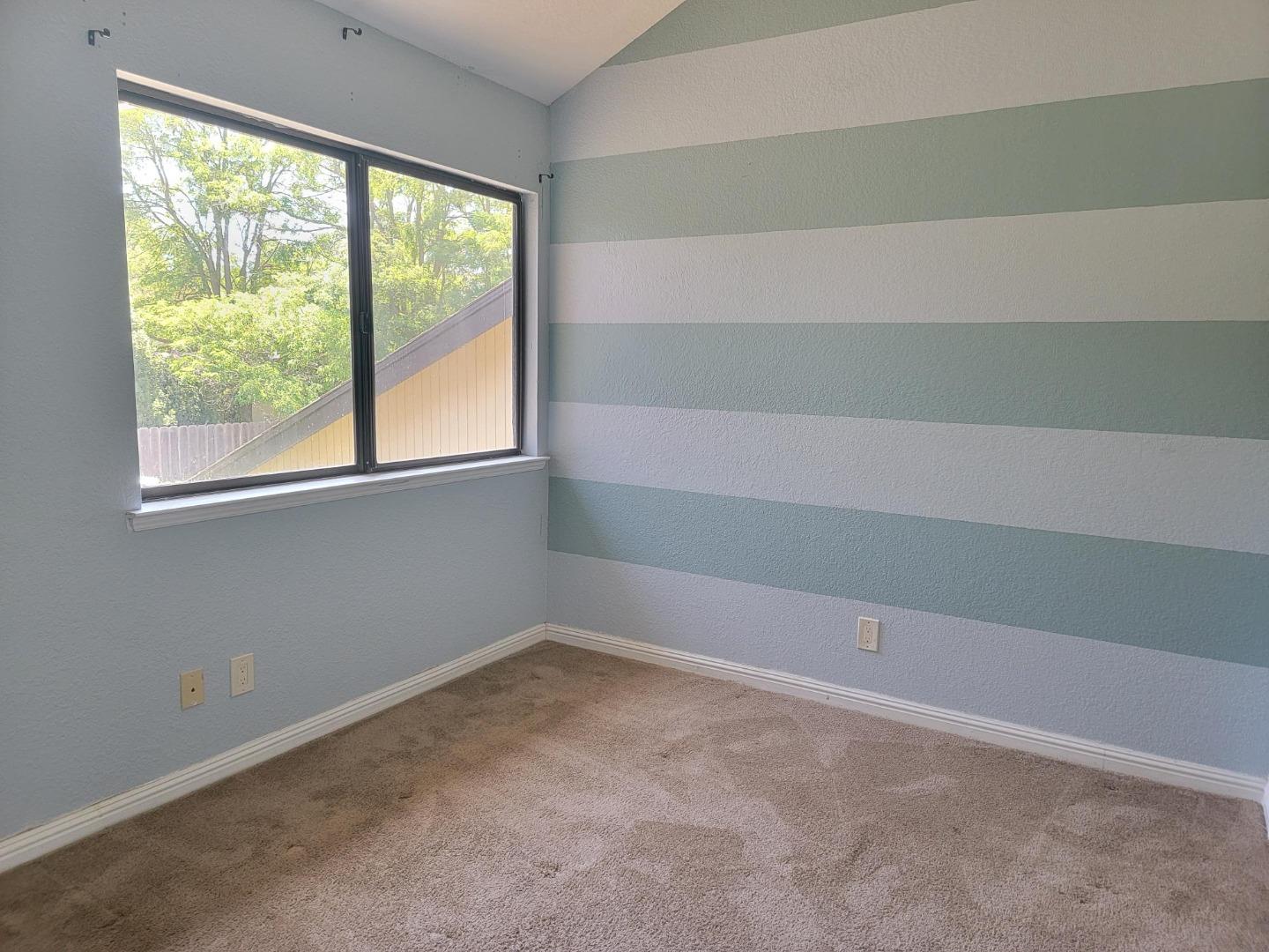 801 Nash Road, Unit A9 Hollister, CA 95023 - Photo 7 of 13 an empty room with a window