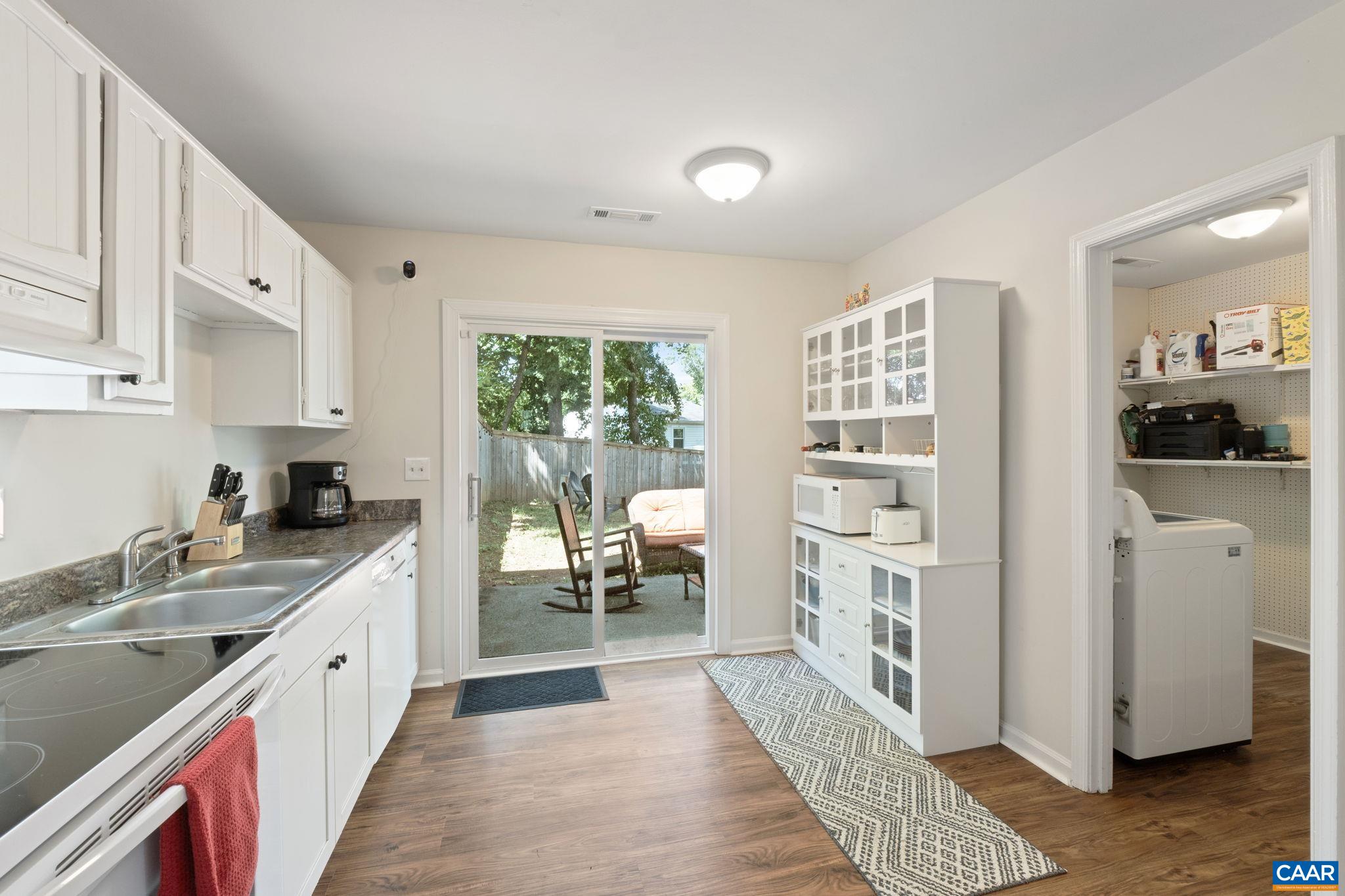705 Prospect Avenue Charlottesville, VA 22903 - Photo 13 of 38 a large white kitchen with a large window