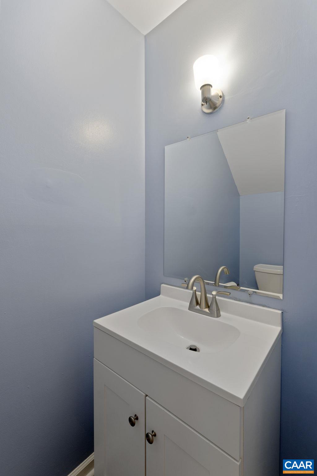 705 Prospect Avenue Charlottesville, VA 22903 - Photo 18 of 38 a bathroom with a sink and a mirror