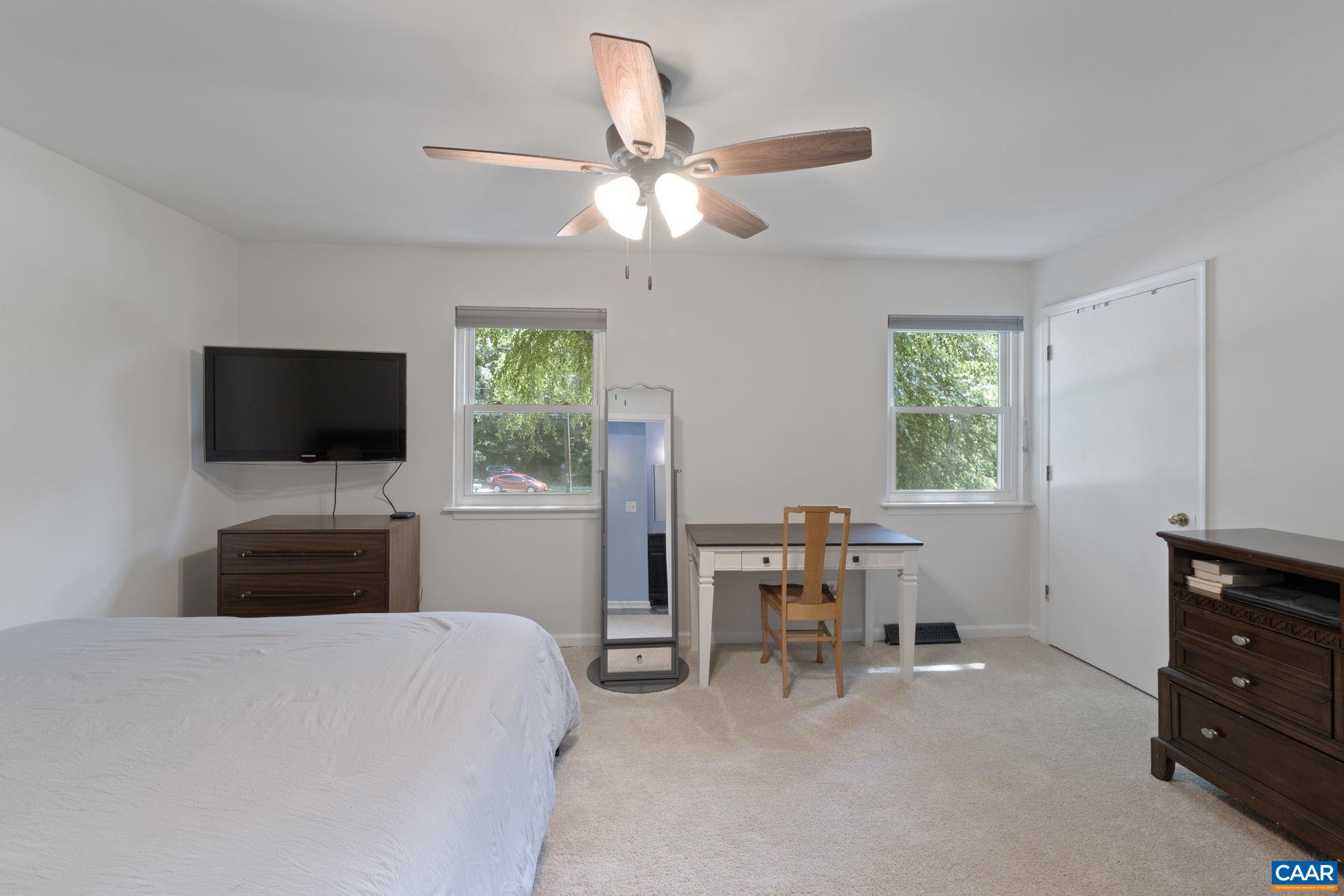 705 Prospect Avenue Charlottesville, VA 22903 - Photo 25 of 38 a bedroom with a bed and a flat screen tv