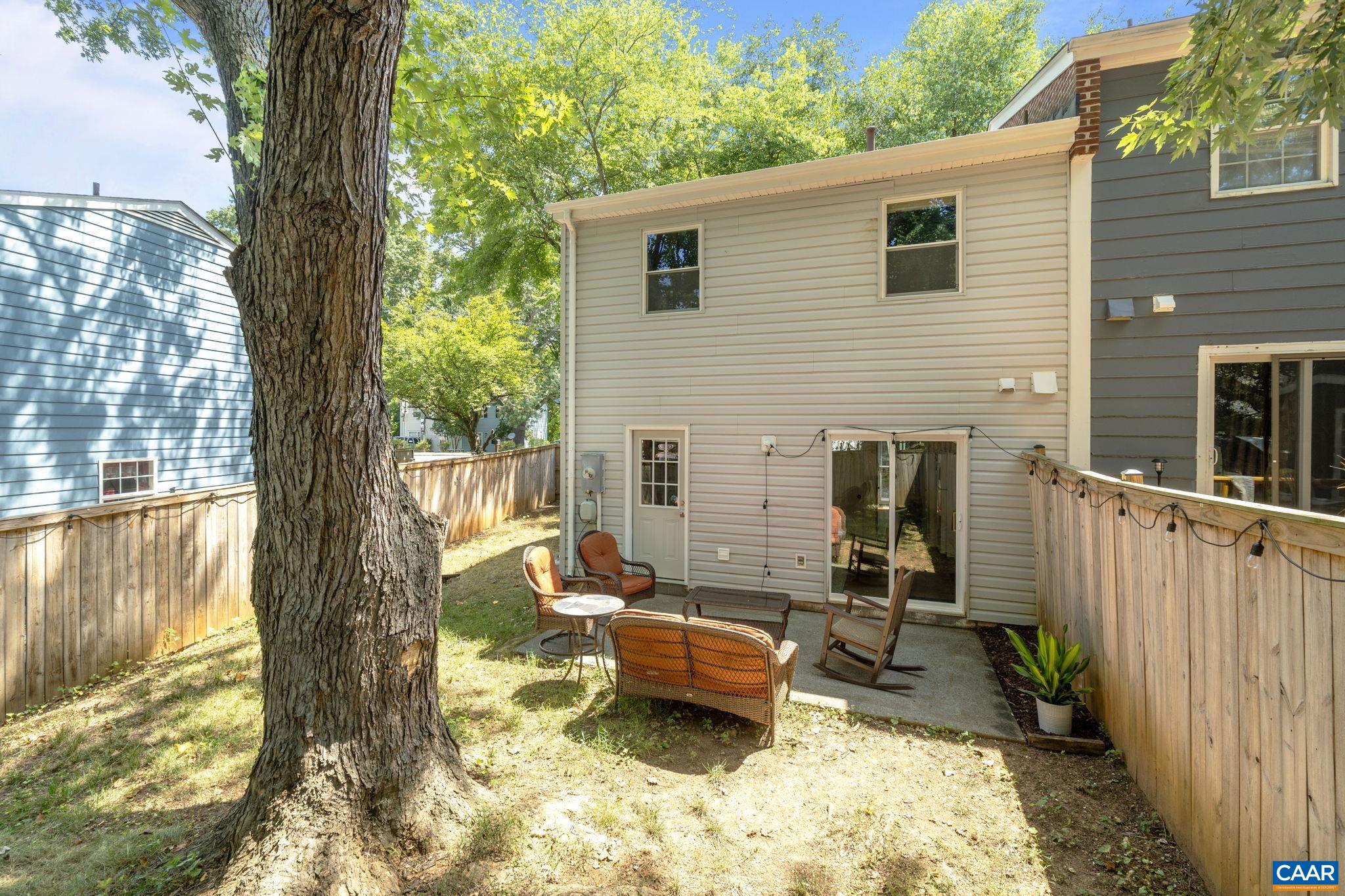 705 Prospect Avenue Charlottesville, VA 22903 - Photo 28 of 38 a view of a patio with a table chairs and a backyard
