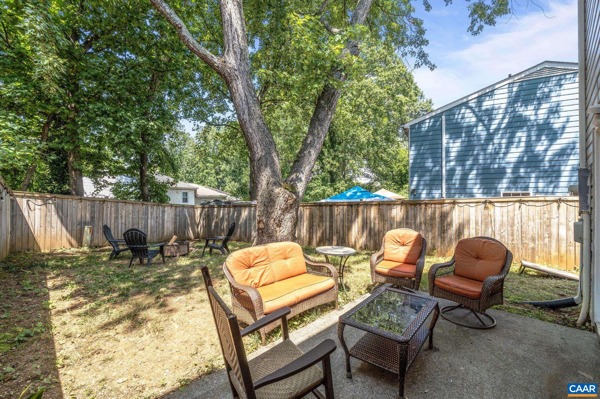705 Prospect Avenue Charlottesville, VA 22903 - Photo 31 of 38 a backyard of a house with table and chairs