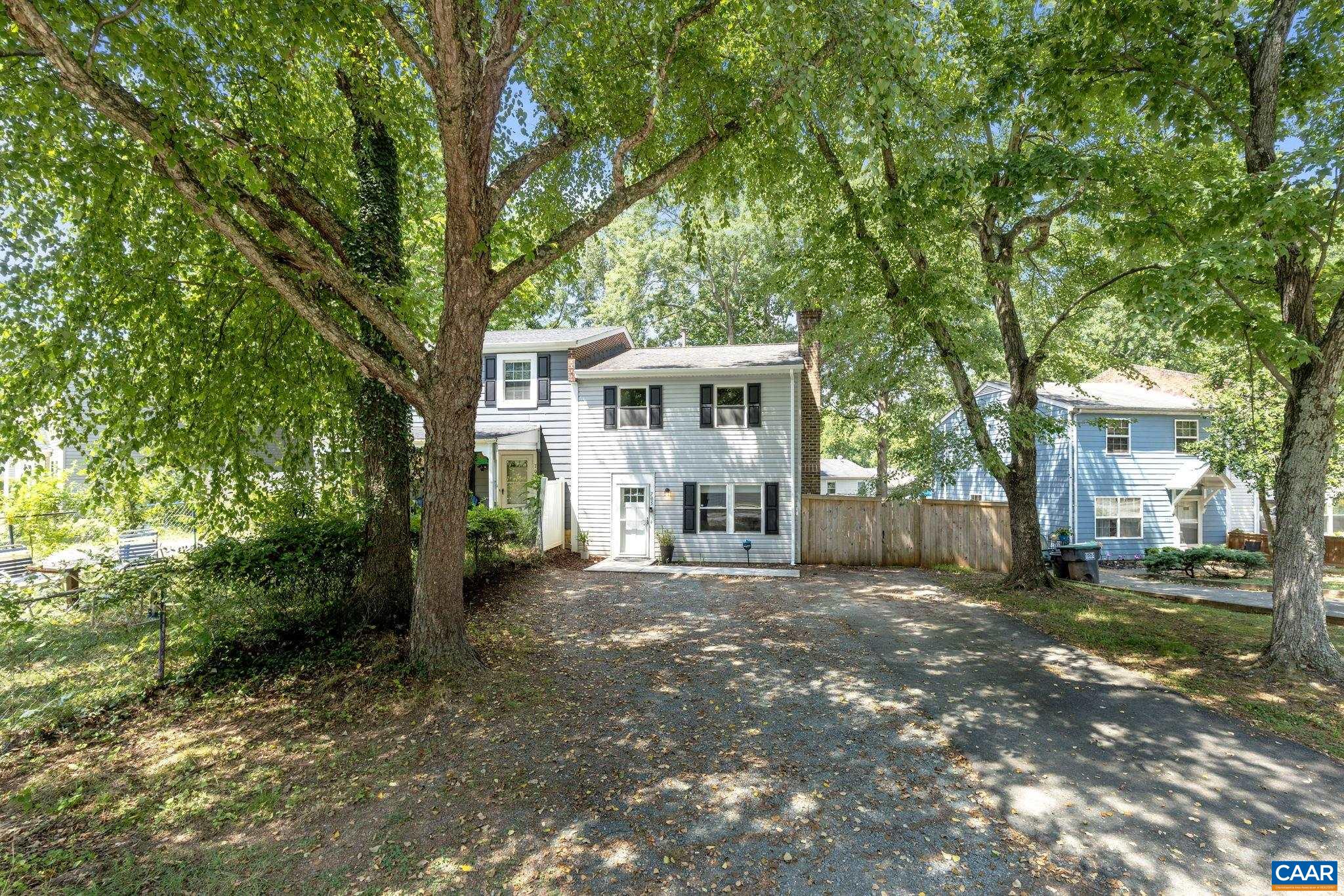 705 Prospect Avenue Charlottesville, VA 22903 - Photo 33 of 38 a view of a white house with a large windows and large trees