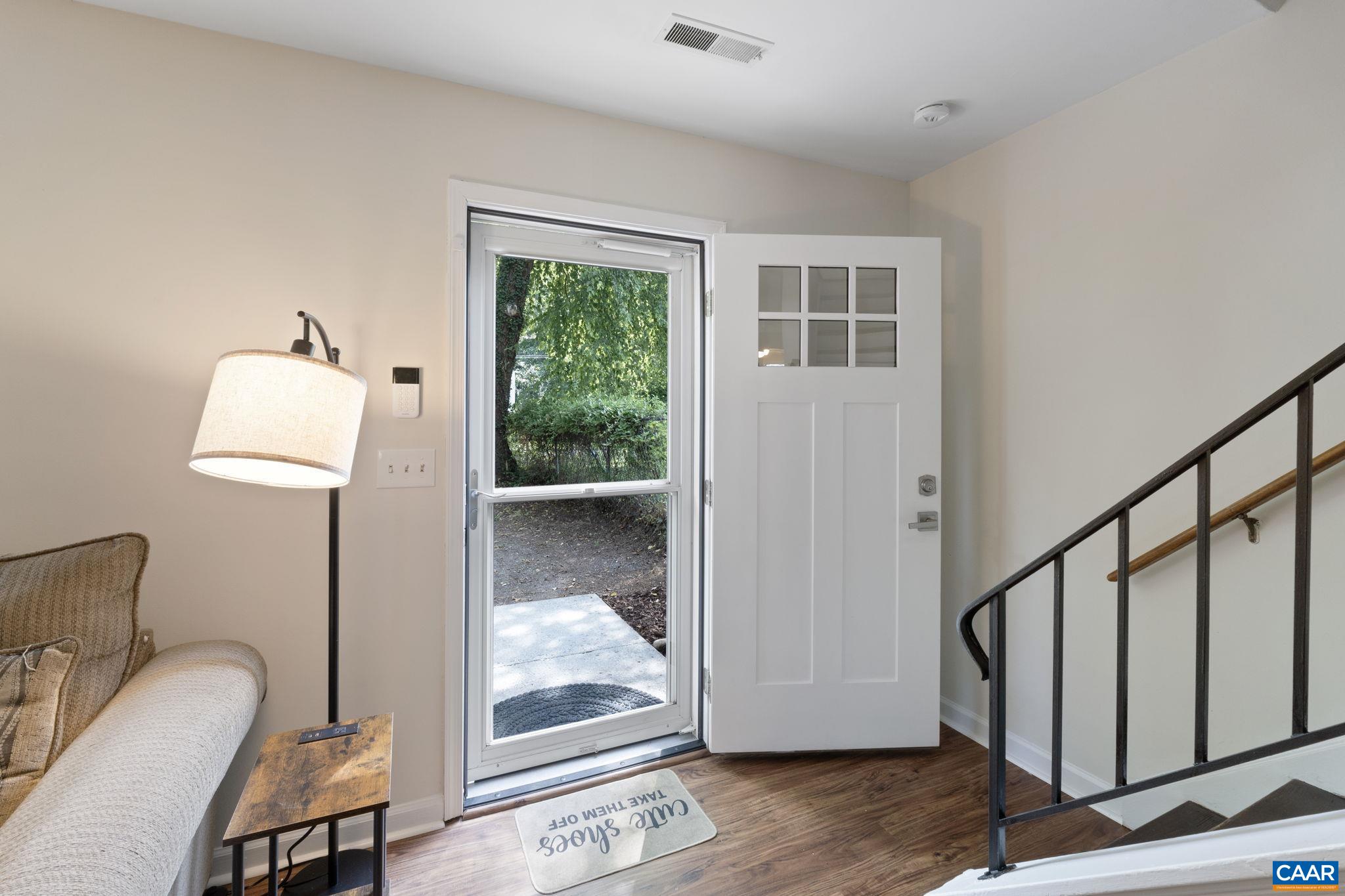 705 Prospect Avenue Charlottesville, VA 22903 - Photo 4 of 38 a view of a hallway with wooden floor and a bathroom