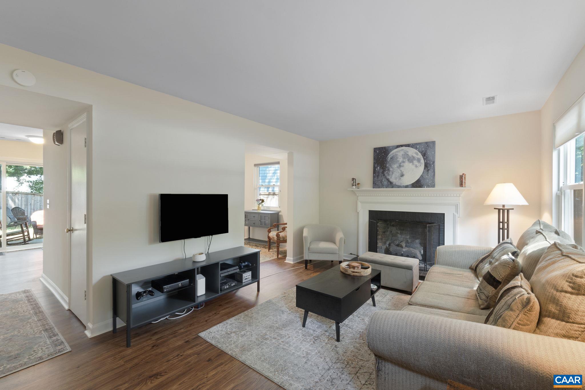 705 Prospect Avenue Charlottesville, VA 22903 - Photo 6 of 38 a living room with furniture and a flat screen tv