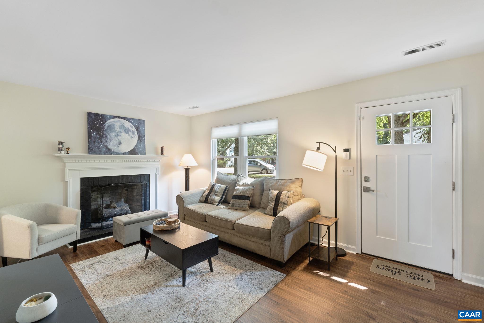 705 Prospect Avenue Charlottesville, VA 22903 - Photo 7 of 38 a living room with furniture and a fireplace
