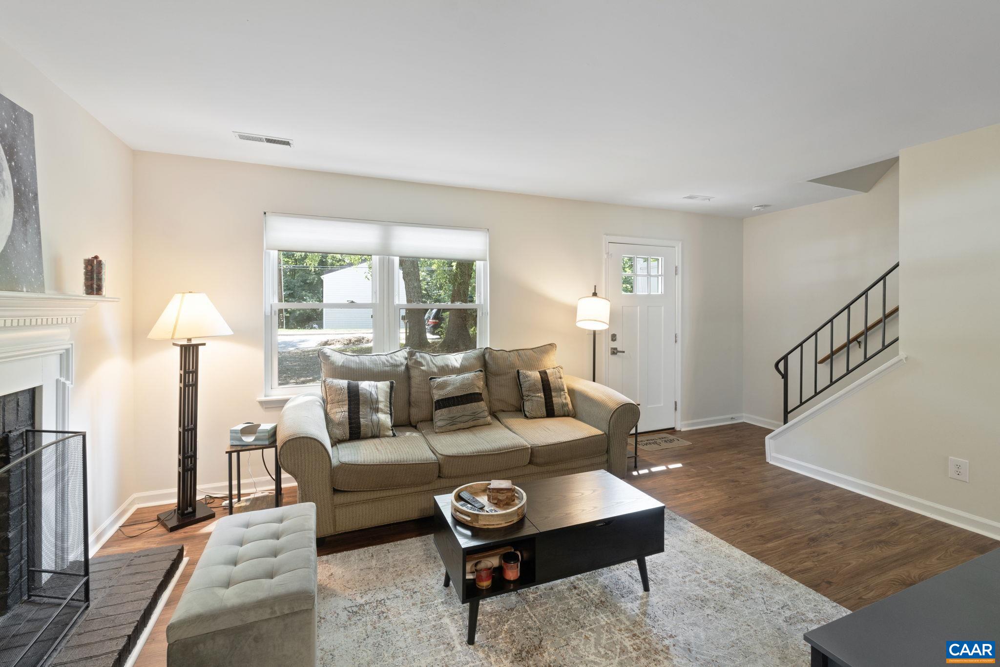 705 Prospect Avenue Charlottesville, VA 22903 - Photo 9 of 38 a living room with furniture and a table