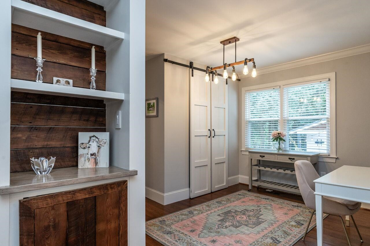 1936 Fairfield Drive Raleigh, NC 27608 - Photo 15 of 27 Office, Dining Room, Studio. This great space overlooks the private back yard. Barn Doors open to a large shelved closet. Flex Room