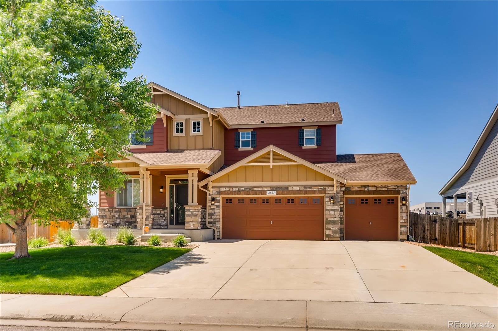 8627 Raspberry Drive Frederick, CO 80504 - Photo 1 of 33 a front view of a house with a garden