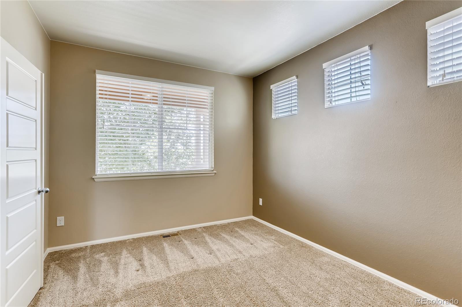 8627 Raspberry Drive Frederick, CO 80504 - Photo 17 of 33 a view of an empty room with a window