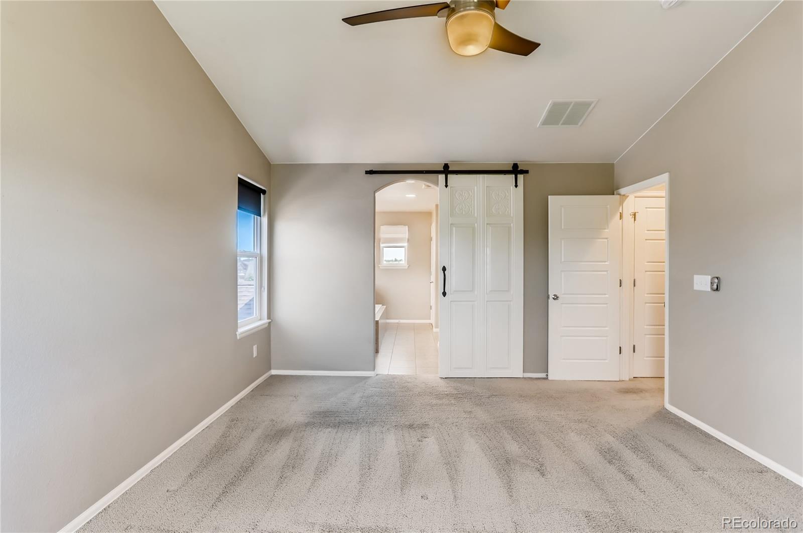8627 Raspberry Drive Frederick, CO 80504 - Photo 20 of 33 a view of an empty room with a window