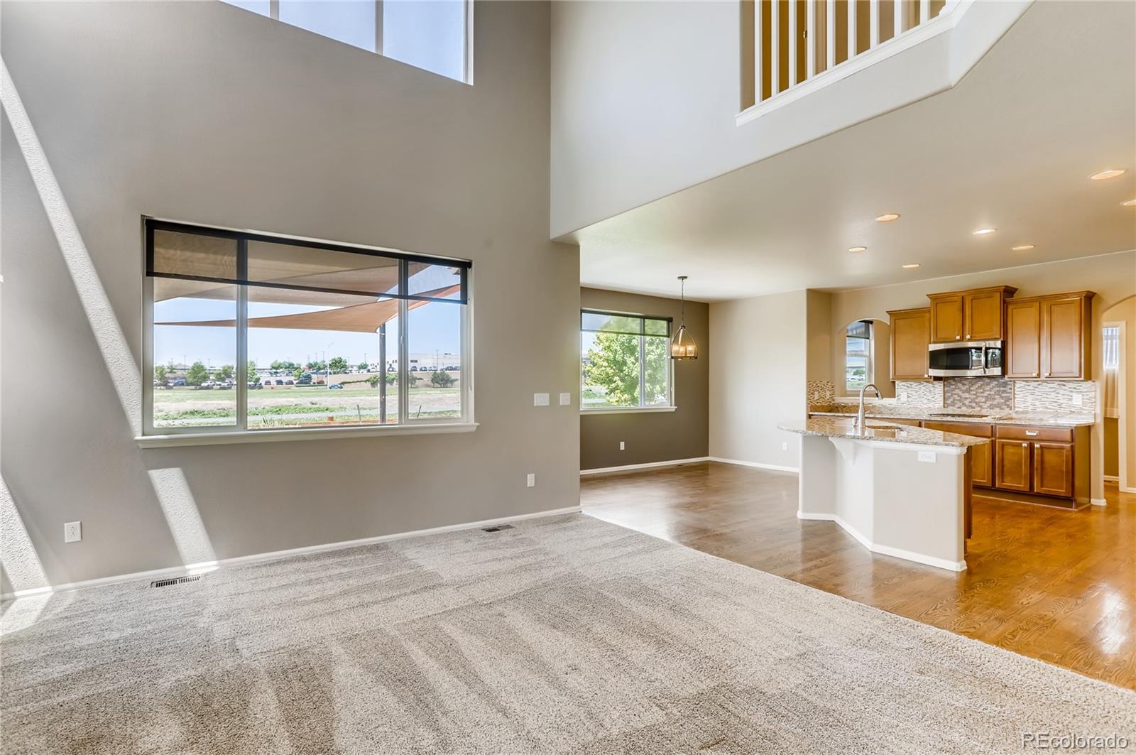 8627 Raspberry Drive Frederick, CO 80504 - Photo 8 of 33 a view of kitchen with granite countertop window and stainless steel appliances