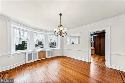a view of a living room and kitchen with a large window