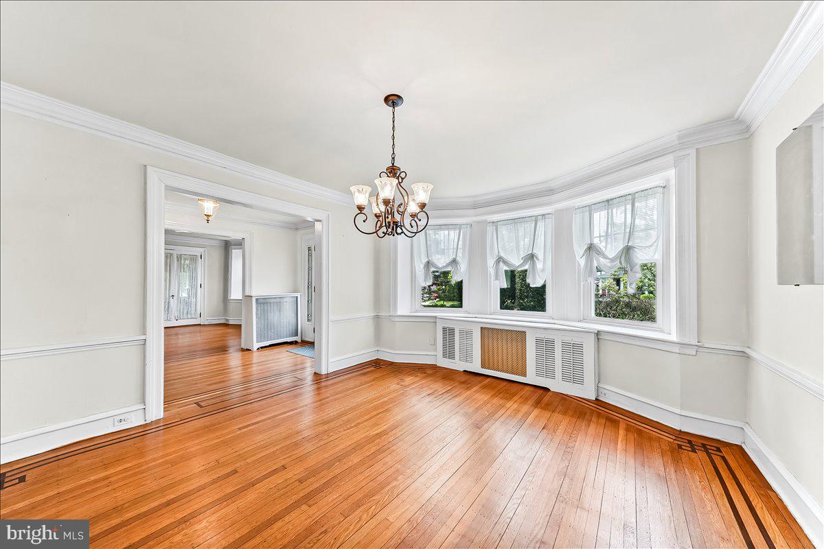 216 East Manoa Road Havertown, PA 19083 - Photo 12 of 37 a view of a living room and kitchen with a large window
